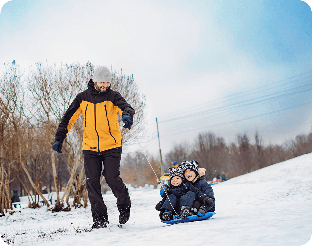 Two people happily playing in the snow